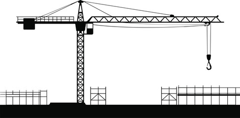 Industrial construction site silhouette with a large tower crane lattice mast and building framework