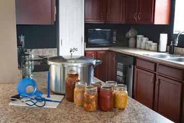 Home Preserved Food with Pressure Canner in Kitchen