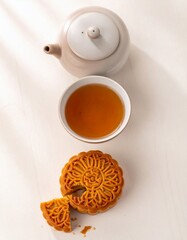 Overhead View of Mooncake Tea and Teapot Composition for Mid Autumn Festival