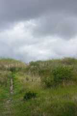 Cloudy sky over beach hill