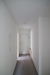 Hallway with a white door and a radiator