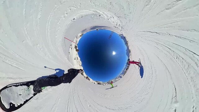 Snowboarding. A snowboarder rides down a mountain slope at a ski resort. Extreme sports and a healthy lifestyle. Pleasure and drive. Winter snow, sun and blue sky 23