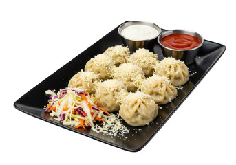 A platter of dumplings topped with cheese and served with dipping sauces and a side of colorful slaw on transparent background