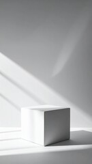 Fototapeta premium White Cube with Strong Shadows Against a White Background in Studio