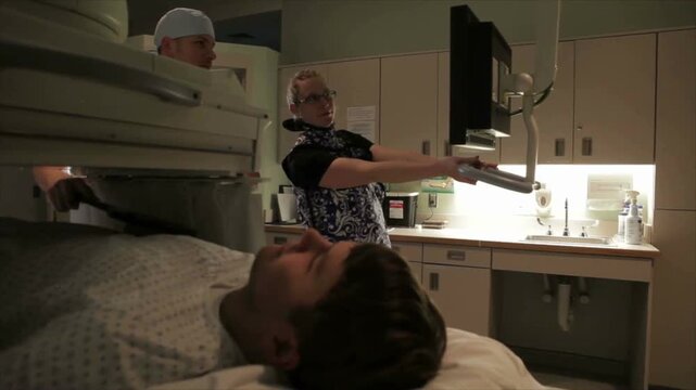 Young Patient Having Fluoroscopy Procedure in Hospital Radiology Department