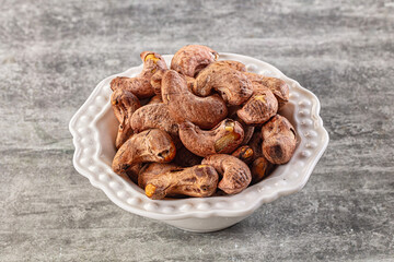 Unpeeled cashew nuts in the bowl