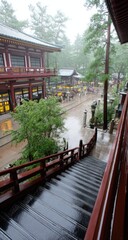 Rain-slicked steps ascend to a traditional temple complex.