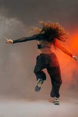 Urban Jazz Funk Dancer Showing Dynamic Back Pose with Dramatic Smoke and Expressive Movement