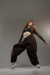 Jazz Funk Dancer in Urban Style Showing Dynamic Modern Dance Pose with Expressive Movement