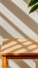 gentle daylight shadows illuminating a close-up of an empty wooden table