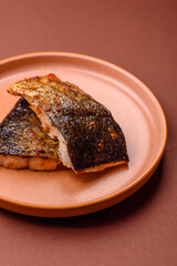 Food, seafood, grilled fish fillet with lemon, salt and spices. Grilled fish fillet