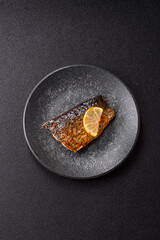 Food, seafood, grilled fish fillet with lemon, salt and spices. Grilled fish fillet