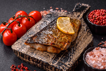 Food, seafood, grilled fish fillet with lemon, salt and spices. Grilled fish fillet