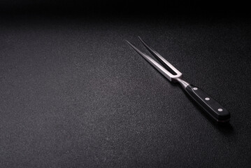 Empty meat or steak fork with vegetables, spices and other ingredients. Meat fork