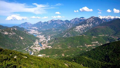 Fototapeta premium Mountain valley vista with town and river