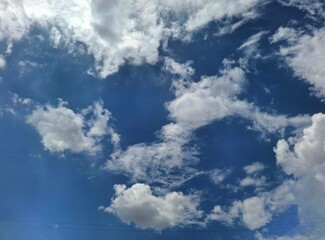 blue sky with clouds.
white clouds high in the blue sky
