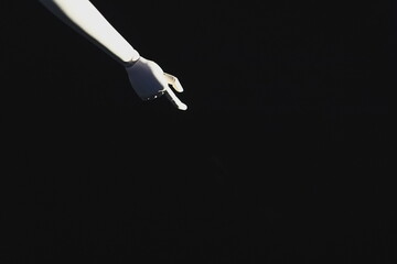 robotic hand, pointing gesture, dark background, minimalism, artificial intelligence, technology...