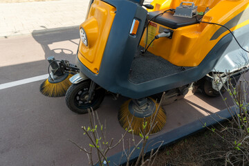 Innovative electric street sweeper efficiently cleaning pedestrian walkways and bike paths for a cleaner, greener urban environment.
