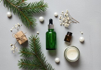 Festive skincare products with fir branches and ornaments