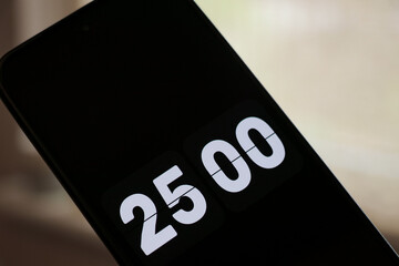 Phone white 25-minute flip clock timer to study with the pomodoro method. Student time planning studying, homework, office productivity.