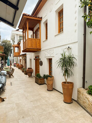 Charming narrow alley in a coastal village showcasing traditional architecture and greenery