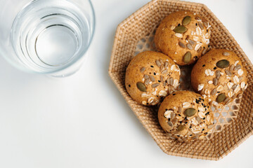 Top view of tasty healthy food in wholegrain bun topping with sunflower seed, oat and wholegrain baked by homemade serving on white table on bakery gourmet bread special menu cafe concept. Infobahn.