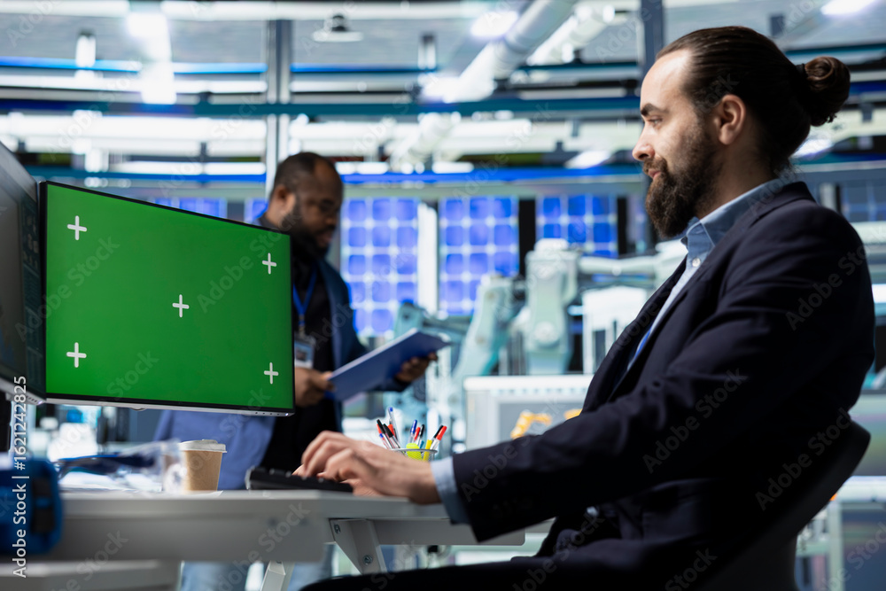 Poster quality control expert reviews production process with copy space display, working at the desk in so