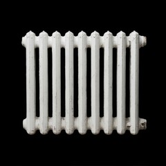 A white cast iron radiator on a black background