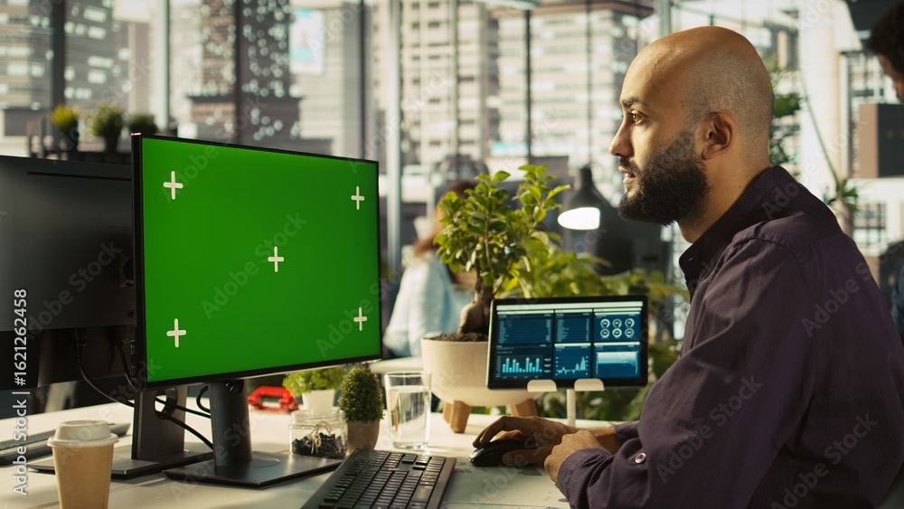 Poster man in office reviewing financial graphs on green screen pc, analyzing key performance indicators. e
