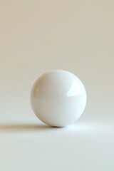 Fototapeta premium A single round white decorative ball, ideal for minimalistic or contemporary home decor. It can be used as a tabletop accent or wall art.