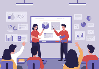 Two presenters explaining data charts and graphs to an attentive audience in a modern classroom setting.