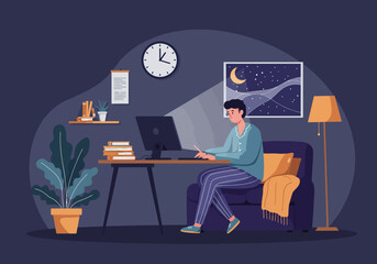 Man works late at night on computer in comfortable home office.