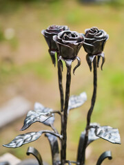 Fine metal rose bouquet made for bride with flower allergy. Excellent passion and romantic gift. Blacksmith and welder craft. Abstract art. Selective focus. Wedding decoration.