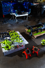 Drift car suspension parts are staged for a suspension build. Vibrant performance suspension...