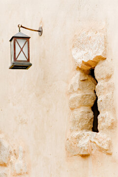 Stone window in an old Adobe wall in Jordan