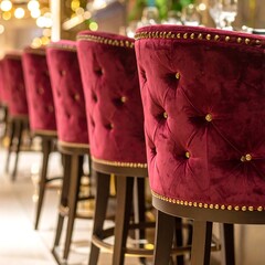 Row of plush burgundy bar stools