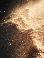 Brown sand and gravel creating a silhouette of texture against the golden backdrop.
