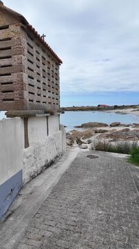 Picturesque h&oacute;rreo standing on the galician coast, showcasing the region's unique architectural heritage and tranquil seaside beauty