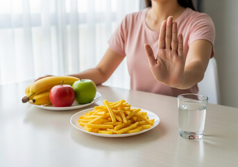 Woman refusing unhealthy food and choosing healthy options for a better lifestyle