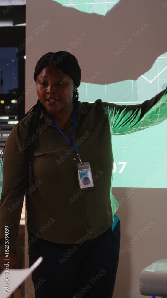 Poster vertical video diverse group of corporate associates look into project timelines and agenda, create 