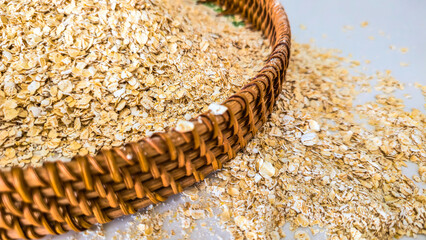 Raw Oats in Hand and Basket
