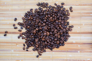 coffee beans on a bamboo mat background. shot with high angle view