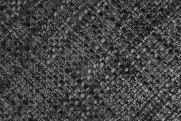 Macro, close up of black woven burlap fabric, cloth texture with thick threads and rough textile pattern. Coarse textile surface with visible fibers. Background, eco design, upholstery material