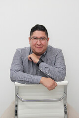 30-year-old Latino man with glasses is proud to be a successful business entrepreneur