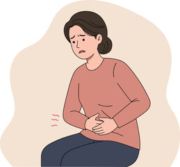 Woman with stomach pain clutching her abdomen