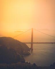 Golden gate bridge at sunset with a beautiful warm fog  © Anthony