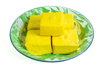 Tahu takwa (tahu kuning, tahu yellow tofu), traditional tofu from Kediri, East Java.This yellow color is tofu soaked with turmeric.