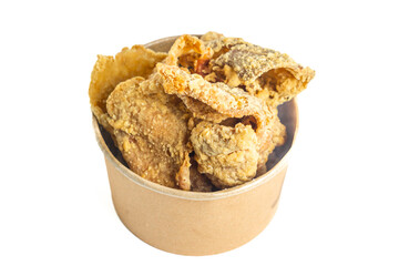 Keripik kulit ayam (Chicken skin chips) in a paper bowl. Indonesian street food.