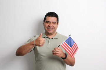 A 40-year-old dark-skinned Latino man displays the American flag and works to obtain citizenship