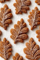 Leaf-shaped gingerbread cookies overhead, cozy and minimal with autumn tones.